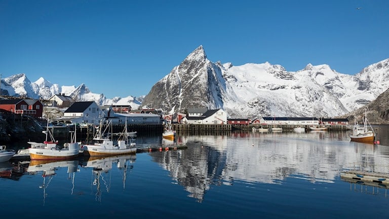 The Skagsanden beach with mountains in the background.